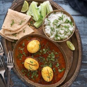 Egg Thali (Egg Curry,1 Dal, 4 Tawa Roti, Rice, Raita, Salad